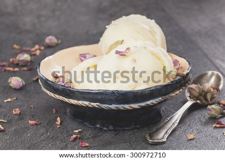 Rose Petal Ice Cream. Ice cream made with rose petal, cardamom, vanilla  and pistachios. Macro,  very shallow depth of field