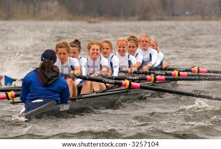 Kansas University Women\'s Rowing Team pulls hard - splashes of water - April 21, 2007 at Minnesota