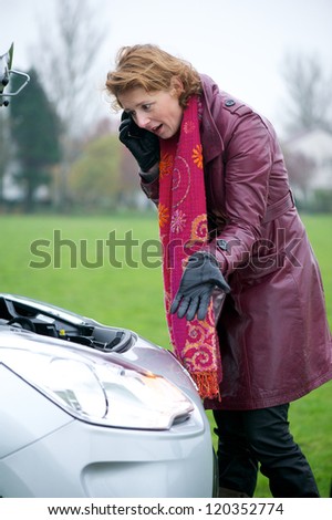 Stressed woman calling for car assistance