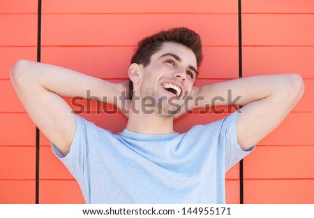Horizontal portrait of a handsome young man laughing
