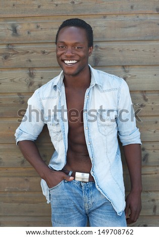 Portrait of an attractive male model smiling outdoors