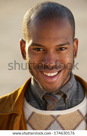 Close up portrait of a handsome black man smiling