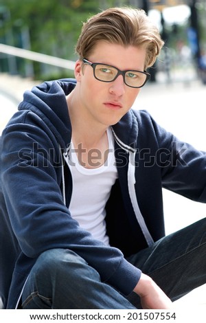 Close up portrait of a cool young man with glasses