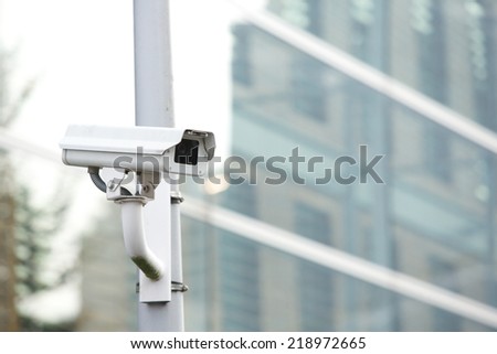 Security camera system on a pole guarding business building