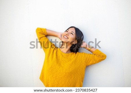 Similar – Image, Stock Photo Young woman leans against a board wall and looks into the camera