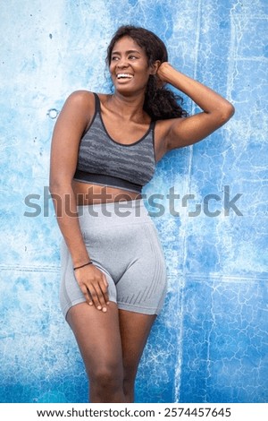 Similar – Image, Stock Photo Afro athlete woman standing outdoors.