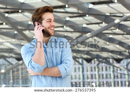 Portrait of a smiling man enjoying conversation on cell phone