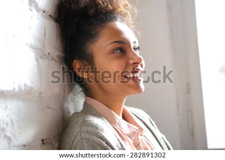Close up candid portrait of a smiling young woman