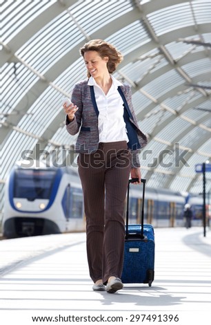 Full body portrait of a traveling business at train station