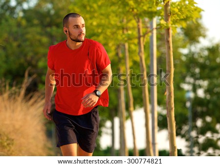 Young man exercise running outdoors keeping fit