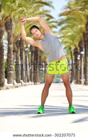 Young man warm up fitness exercise workout outside