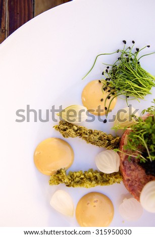 Close up top view luxurious food starter with caviar and steak tartare