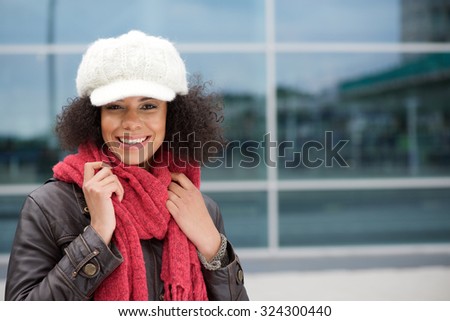 Close up portrait of a smiling young woman in winter clothes