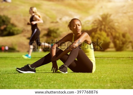 Similar – Foto Bild Sportliche Frau ruht sich nach dem Training im Fitnessstudio aus