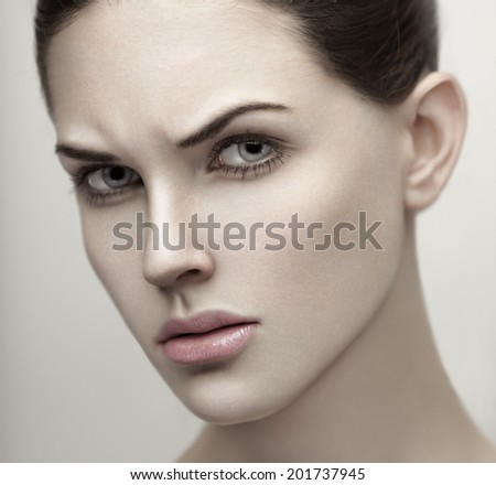 Closeup beauty portrait of beautiful brunette girl with natural makeup.