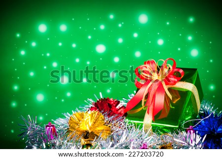 Celebration theme with christmas & new year gifts,snow effect on green background