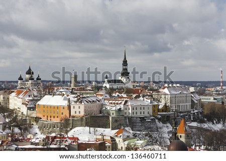 Historic Old Town of Tallinn, capital of Estonia. Roofs of houses are covered with snow.