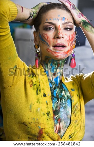 Beautiful brunette with colorful body painting,  creative body art