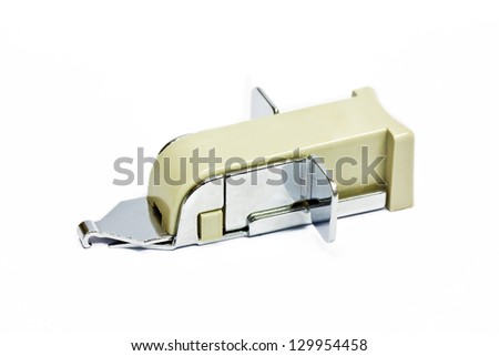 A staple remover on white background