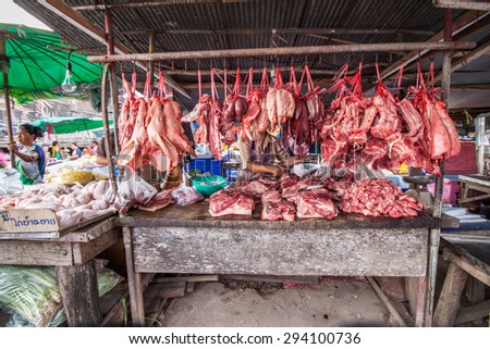 Trang,Thailand - February 2nd, 2015: Hanging pork and meat at butcher shop stall at Huai Yod fresh food market on 2 February 2015