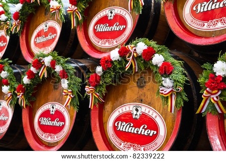 VILLACH, AUSTRIA - AUGUST 6: Old wooden beer barrels at a traditional beerwagon at the \'Villacher Kirchtag\', the largest traditional folk festival in Austria, August 6, 2011 in Villach, Austria.