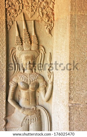 SIEM REAP, CAMBODIA - DECEMBER 21: Wall bas-relief of Devata in Angkor Wat temple on December 21, 2011 in Siem Reap, Cambodia. Angkor Wat is the world\'s largest single religious monument.