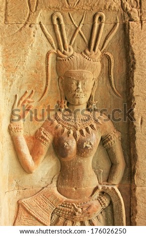 SIEM REAP, CAMBODIA - DECEMBER 19: Wall bas-relief of Devata in Angkor Wat temple on December 19, 2011 in Siem Reap, Cambodia. Angkor Wat is the world\'s largest single religious monument.