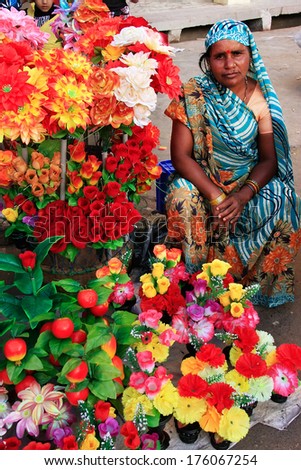 JODHPUR, INDIA - FEBRUARY 11: An unidentified woman sells flowers at Sadar Market on February 11, 2011 in Jodhpur, India. Jodhpur is the second largest city in the Indian state of Rajasthan.