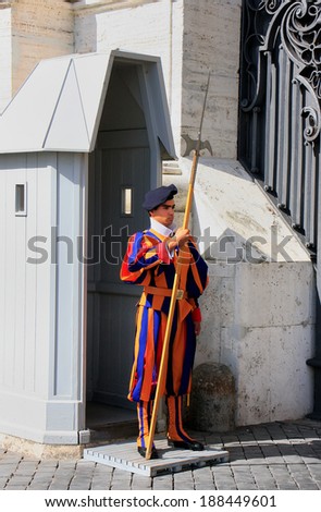 VATICAN - AUGUST 4: An unidentified man guards the gate on August 4, 2011 in Vatican. Vatican City is the smallest internationally recognized independent state in the world.