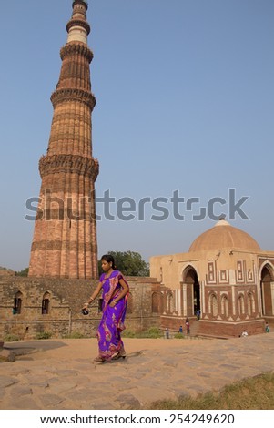 DELHI, INDIA - NOVEMBER 4: Unidentified woman walks near Alai gate at Qutub Minar complex on November 4, 2014 in Delhi, India. Qutub Minar is the tallest minar in India