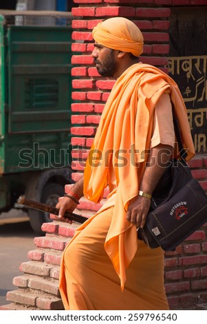 DELHI, INDIA - NOVEMBER 5: Unidentified man walks in the street on November 5, 2014 in Delhi, India. Delhi is the second most populous city in India.