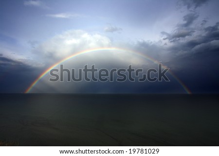 Rainbow on seacoast after a summer thunder-storm