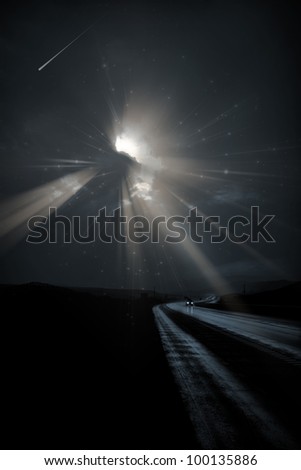 Single car travels on dark road under stars