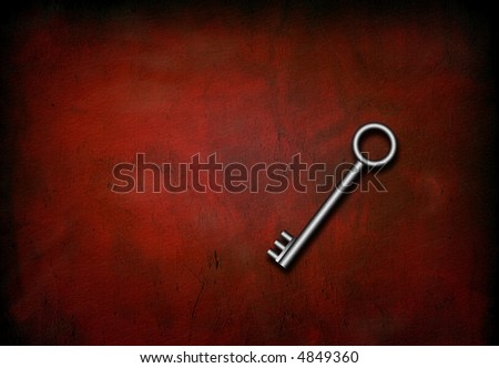 Silver Skeleton Key on red grunge surface
