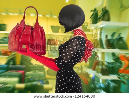 Elegant lady with stylish short hairstyle holding a bag