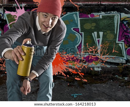 Young graffiti artist with copy space