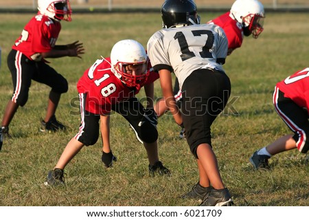 Youth football player in a middle of a game