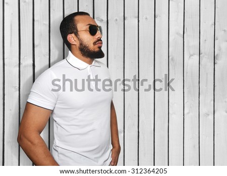 bearded male wearing white t-shirt with collar