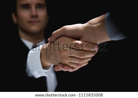 Business partners making handshake in dark shadow Stok fotoğraf © 