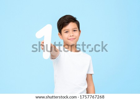 Similar – Image, Stock Photo Cute boy holds on to the horizontal bar and looks at the camera