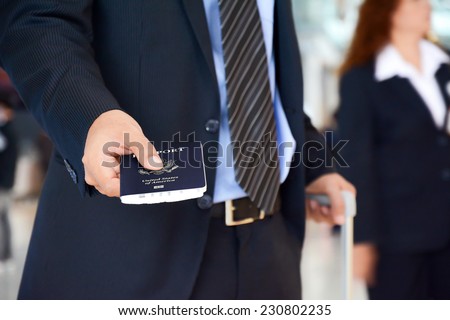 Businessman showing U.S. passport - business trip, check in , boarding & airport immigration concept