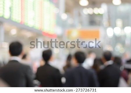 Blurred group of businessmen inside the building hallway
