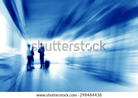 Blue business abstract background with people standing in the corridor, zoom effect