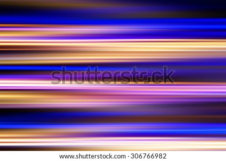 Colorful light streaks at night (long exposure shot) - abstract background
