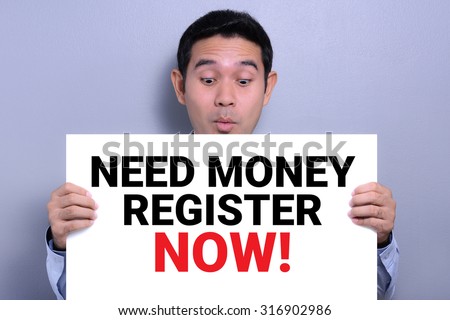 NEED MONEY REGISTER NOW! message on white paper held by a man with excited face