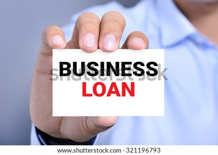 BUSINESS LOAN message on the card shown by a man