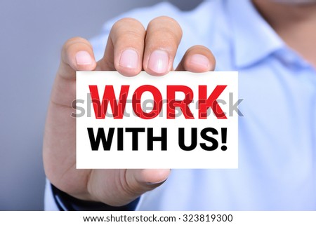 WORK WITH US ! message on the card shown by a man