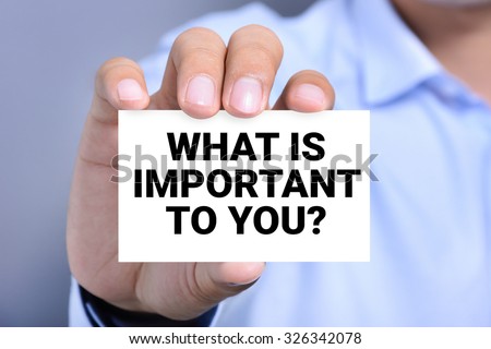 WHAT IS IMPORTANT TO YOU, message on the card shown by a man
