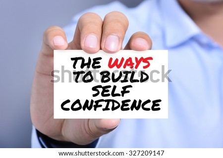 THE WAYS TO BUILD SELF CONFIDENCE, message on the card shown by a man