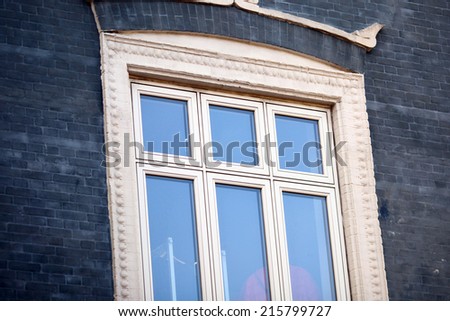 White frame of a window on gray wall